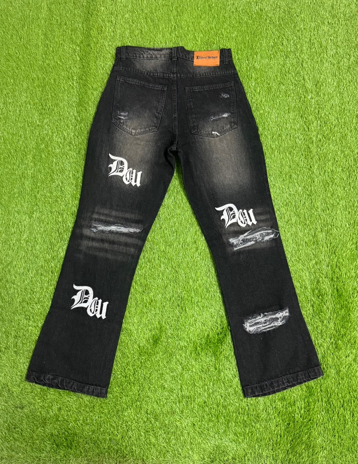 Black Worldwide Distressed Denim Jeans